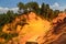 View of the ocher land in the park `Sentiers des Ocres` near the village of Roussillon, France.