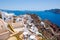 View of Oia town and the castle of Oia towards Thirassia, Thera (Santorini),Greece.