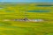 View of the oil rig in the tundra from a helicopter.