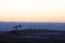 View of Oil Well Pumpjack at Sunset Oil Industry