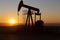View of Oil Well Pumpjack at Sunset Oil Industry