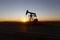 View of Oil Well Pumpjack at Sunset Oil Industry