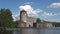 View of Olavinlinna castle from the water area of lake Pihlajavesi, june day. Savonlinna, Finland