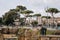 View of an old architecture ruins. Old town, Rome. Tourists walking.