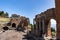 View of old, brick ruins of Ancient Theater of Taormina on a sunny day