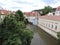 View of old buildings, river and trees,  Prague, Czech Republic