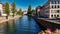 View of the old buildings on the riverbanks reflecting on water of river Ill, Strasbourg, Strasbourg downtown