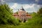 View of the old castle on sunny day against the blue sky in Zolochiv, Lviv region in Ukraine.