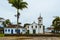 View of old church and houses in the street of colonial historical city in Brazil