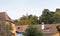 View of the old city over the roofs of houses in the city of Sighisoara in Romania