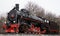 View of old classic black soviet steam locomotive with red star on front