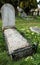 View of an old English cemetery showing thew various styles of gravestones.