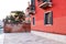 View of the old european red houses in Italy concept photo. Street scene, old wall and window.