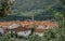 View of the old house roofs of the town of Starigrad on the island of Hvar. Church belltower rising above the buildings. Green