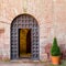 View of the old iron door of the monastery Escornalbou in Tarragona, Spain. Copy space for text.