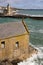 View of the Old Lifeboat House in Porthleven, Cornwall on May 11, 2021. Unidentified people