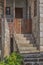 View of old and rustic house, with outside staircase in the entrance