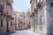 View of old street, facades of ancient buildings in Ortygia Ortigia Island, Syracuse, Sicily, Italy, traditional architecture