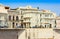 View of old street, facades of ancient buildings in seafront of Ortygia Ortigia Island, Syracuse, Sicily, Italy