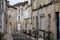 View on old streets and houses in Cognac white wine region, Charente, walking in town Cognac with strong spirits distillation