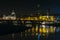 View of the old town of Dresden at night with a view of water and the reflection of the city as well as, churches, towers and bui