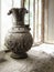 View of an old vase with delicate and beautiful Iranian designs and carvings behind an old open window with a light shining inside