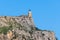 View of Old Venetian Fortress of Corfu, Palaio Frourio, Kerkyra old town, Greece, Ionian sea islands, with the lighthouse, Clock