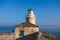 View of Old Venetian Fortress of Corfu, Palaio Frourio, Kerkyra old town, Greece, Ionian sea islands, with the lighthouse, Clock