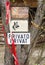 View of an Old Weathered `Private` Sign. various old signs of access prohibition.