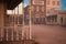 View from an old wooden house across a dusty street in an old town in the American wild west. 3D rendering