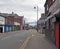 A view of oldham road in ashton under lyne showing the derelict theatre closed shops bars and businesses