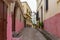 View of the one of the colorful old streets in the Tangier Medina quarter in Northern Morocco. A medina is typically walled, with