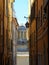 View of one of the towers of Basilica di San Maurizio in Porto Maurizio taken from a street leading to the church