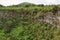 View of one of the twin volcanic craters in the highlands of Santa Cruz