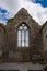 A view of one of the windows inside the ruins of Clare Abbey a Augustinian monastery just outside Ennis, County Clare, Ireland