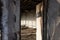 View through an open door to a burnt room after a fire.