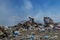 View of an open landfill, food and plastic waste products polluting in a trash dump