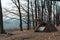 View of a open tourist tent with a quick-build system, brown. no people. place for text. Dull dark tones of autumn morning, winter