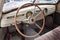 View from opened window with the steering wheel and the interior of the old Russian car of the executive class released in the