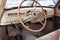 View from opened window with the steering wheel and the interior of the old Russian car of the executive class released in the