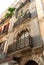 View of ornate apartment facades and balconies in the city centre, Malaga, Spain.