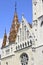 View of ornately colored tile roof of St. Matthias Church on blue sky background. Fisherman`s Bastion in Budapest