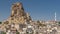 View of Ortahisar town old houses in rock formations from Ortahisar Castle aerial timelapse.