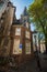 View of Oude Kerk Old Church from across the Oudezijds Voorburgwal canal in Amsterdam, Netherlands