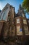 View of Oude Kerk Old Church from across the Oudezijds Voorburgwal canal in Amsterdam, Netherlands