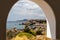 View out of an archway on the rocky coastline at Kallithea Therms, Kallithea Spring on Rhodes island, Greece