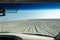 View out of a car windshield in Khor Al Adaid desert in Qatar