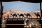 View out of luxury tent to dunes with arabian camels in Abu Dhabi. Tent decorated with lantern, laying camel, caravan silhouette