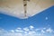 View out of a small plane in to blue sky with small white clouds