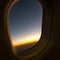 View out the window of an airplane at Sunset